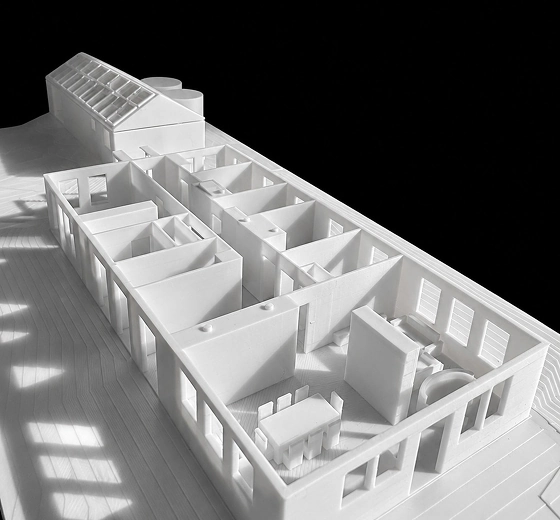 A 3D printed architectural model of a residential floor plan